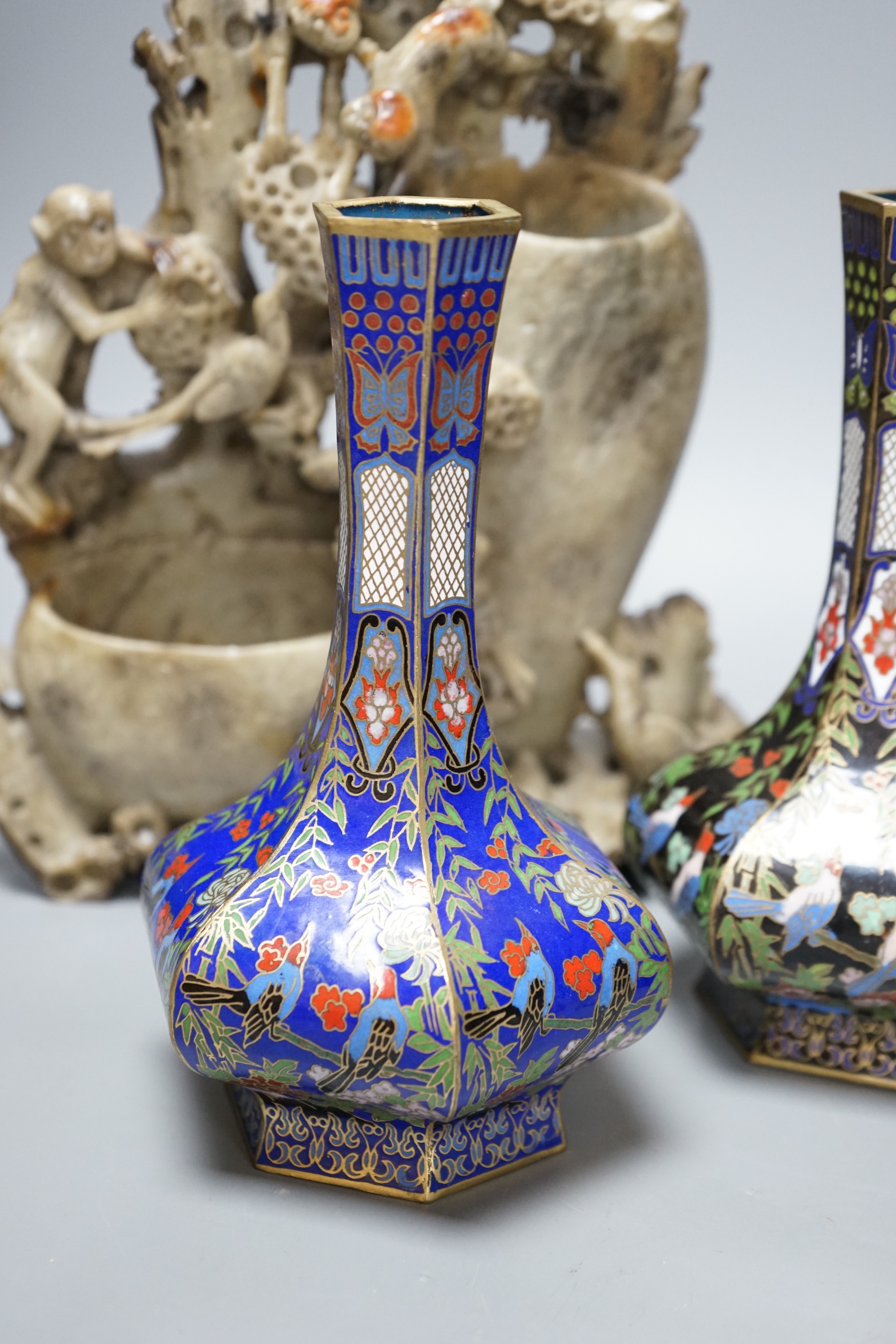 Two Chinese champlevé enamel vases, a soapstone carving and three early 20th century Chinese carved hardwood figures, tallest 26cm